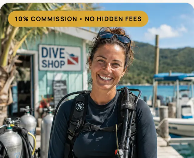 A dive shop operator in Puerto Vallarta standing outside her shop in scuba gear